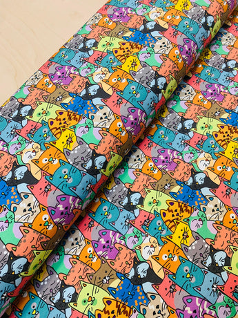 Colourful cats design printed on soft cotton jersey fabric, ideal for vibrant textiles and creative apparel projects