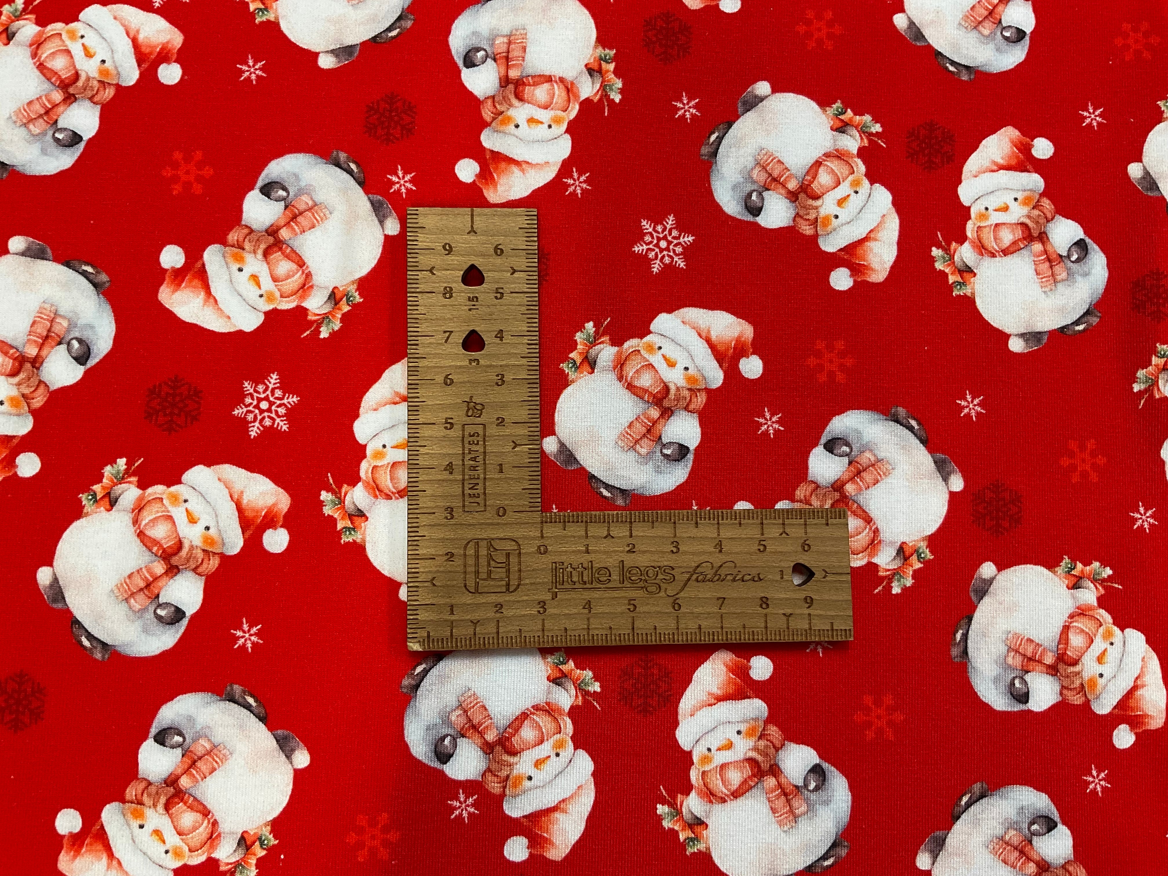 Snowmen on Red Cotton Jersey Fabric