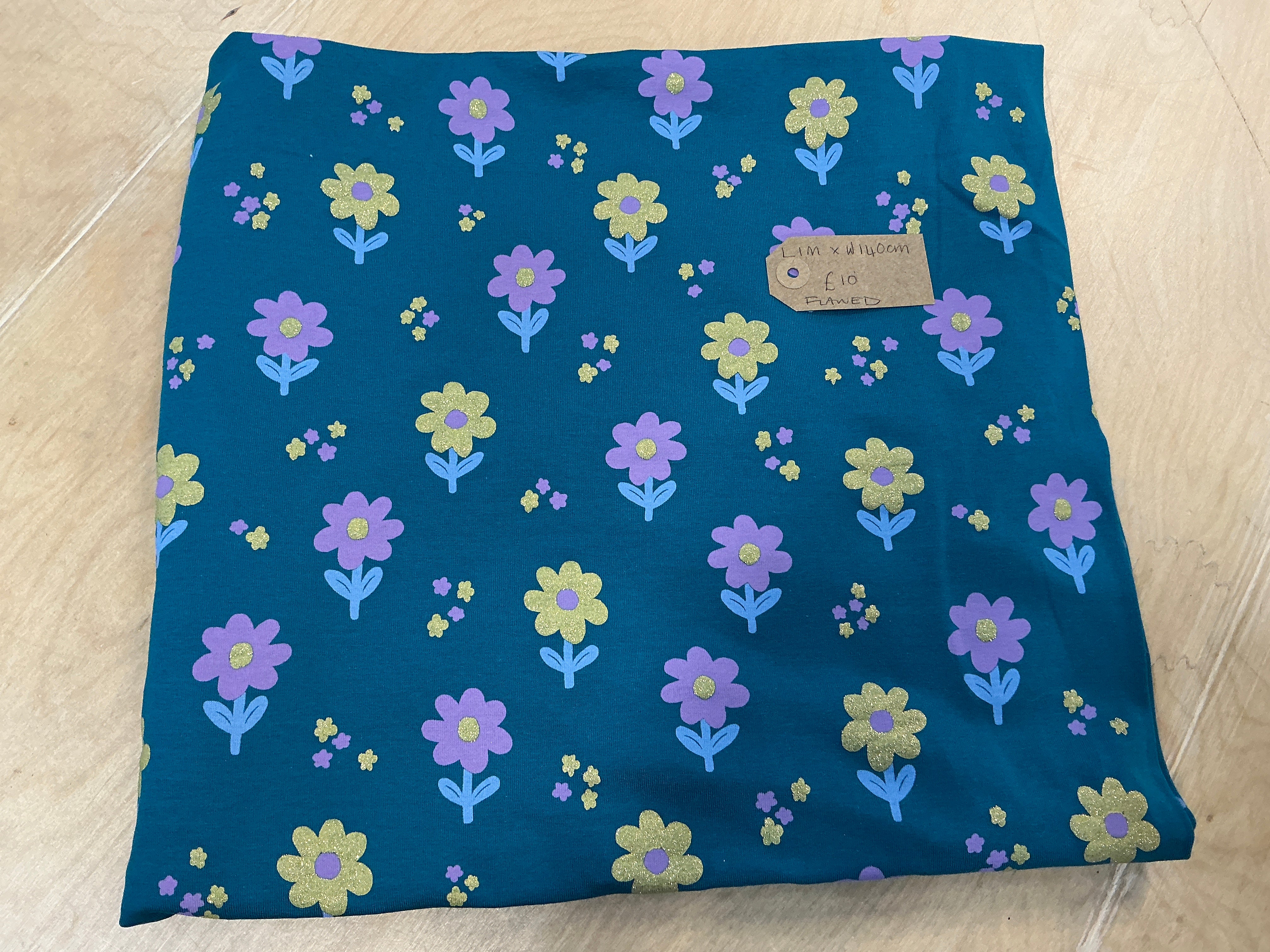 REMNANT  - (FLAWED) L1M x W140cm Glitter Flowers on Teal Jersey