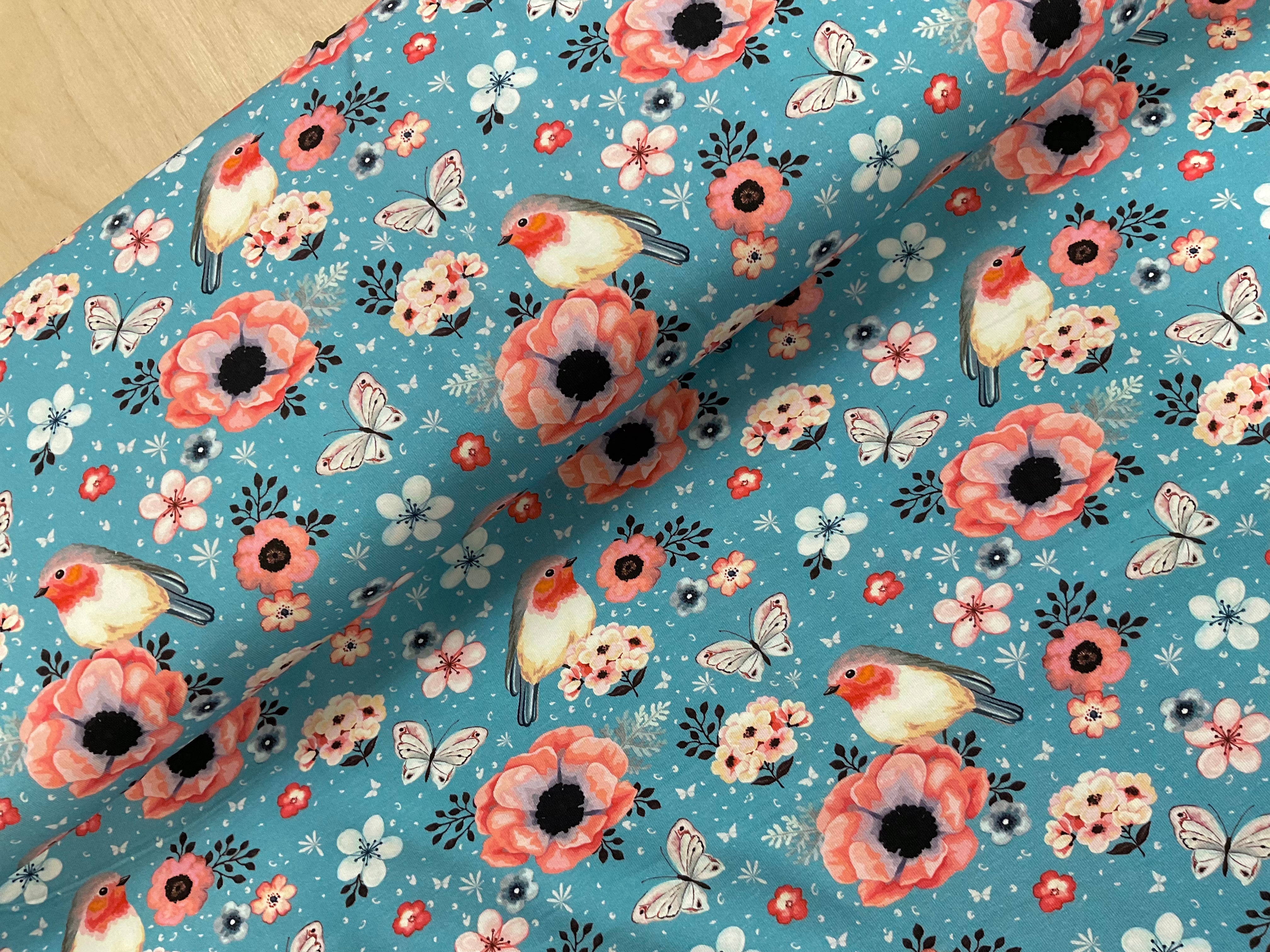 Floral Robbins on Sky Cotton Jersey Fabric