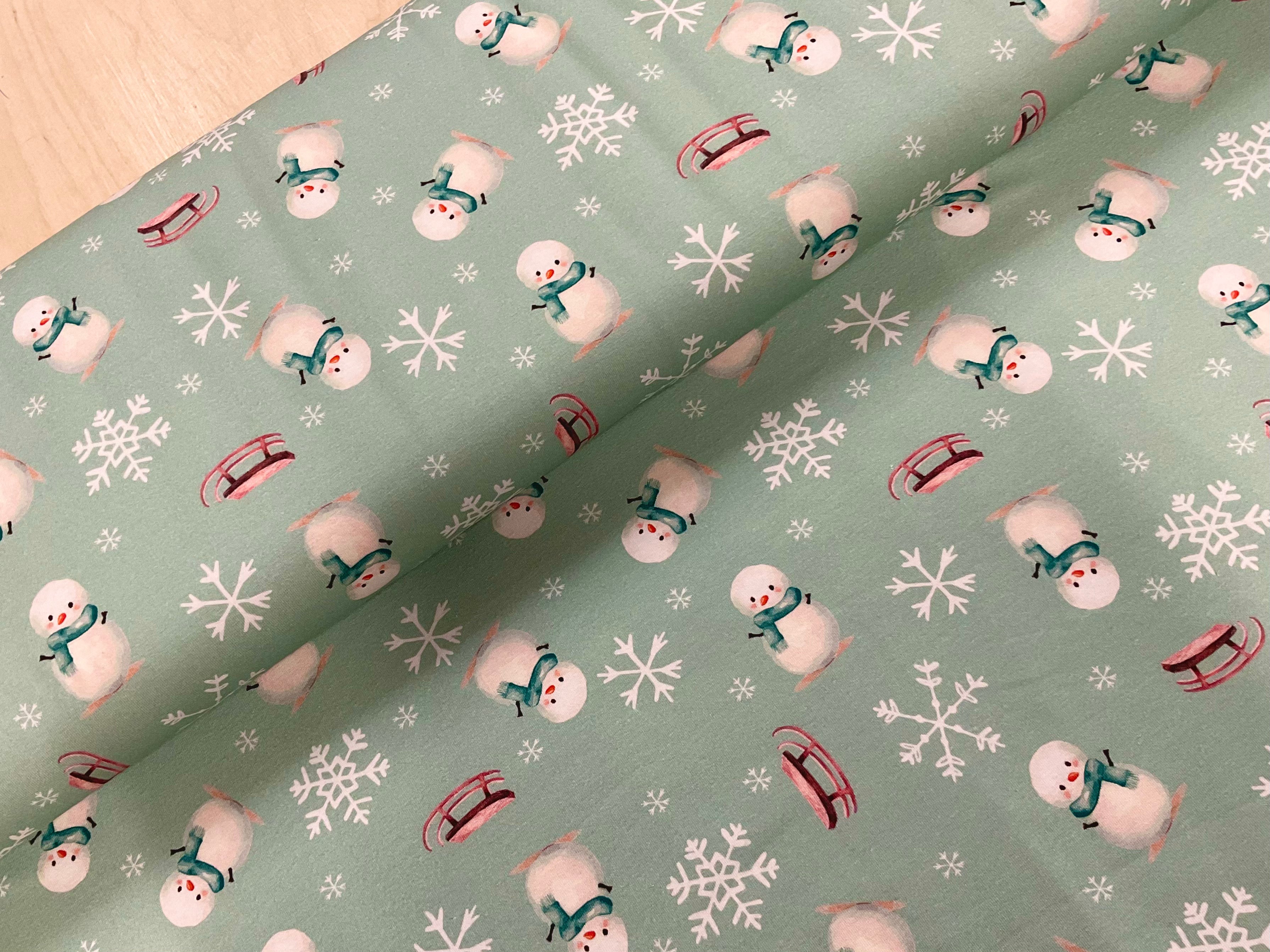 Cute Snowman on Mint Cotton Jersey Fabric