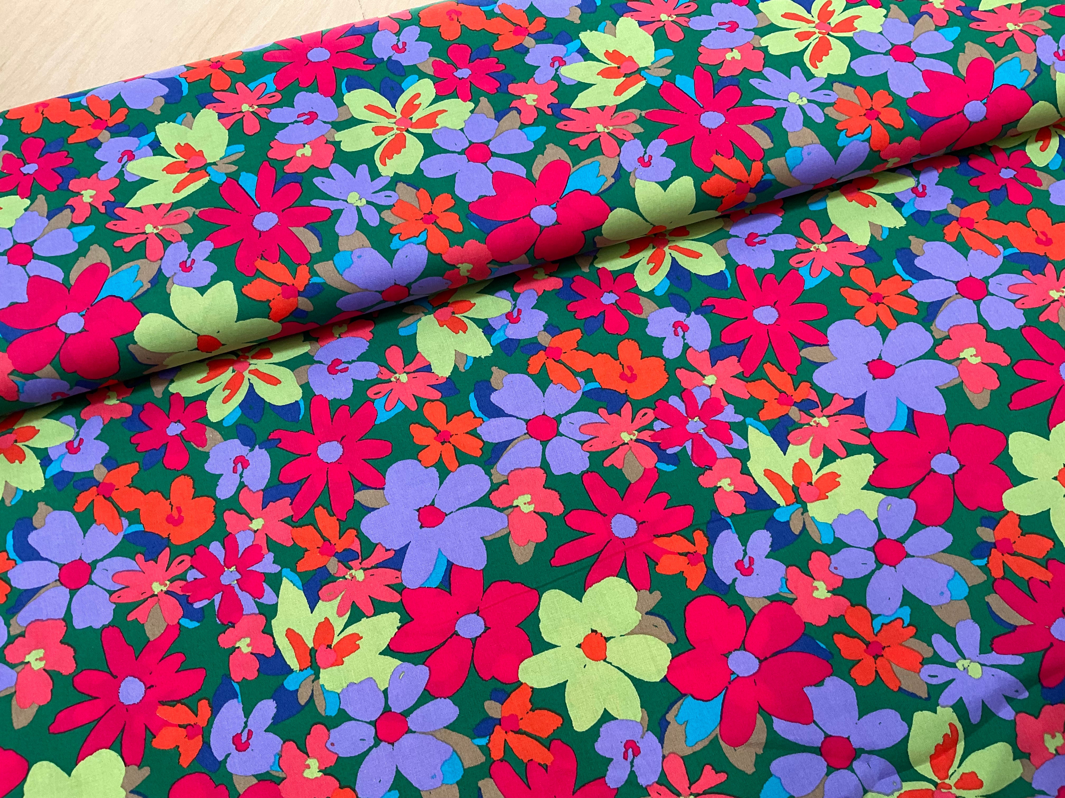 Colour burst Flowers on green Cotton Poplin