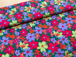 Colour burst Flowers on green Cotton Poplin