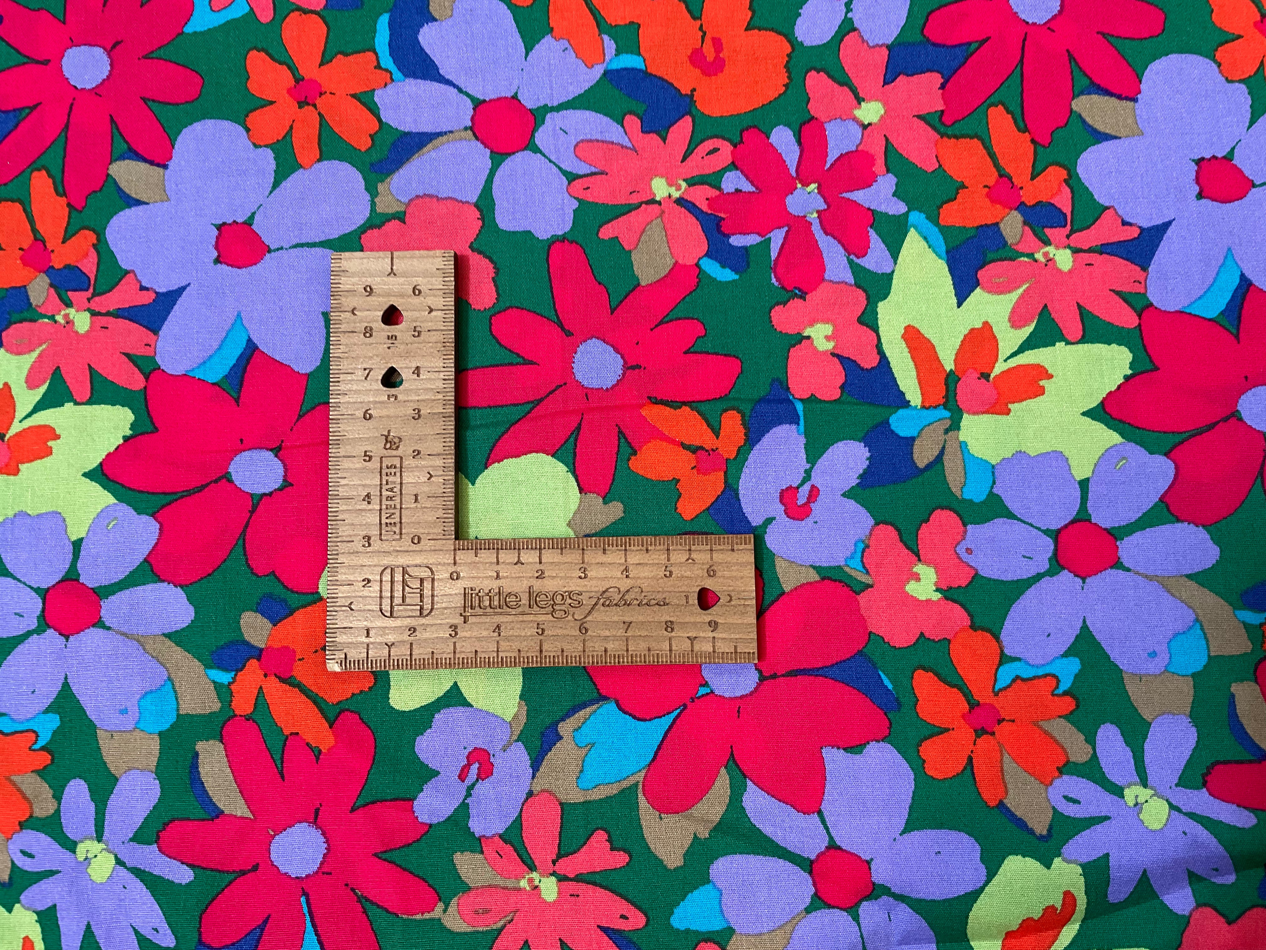 Colour burst Flowers on green Cotton Poplin