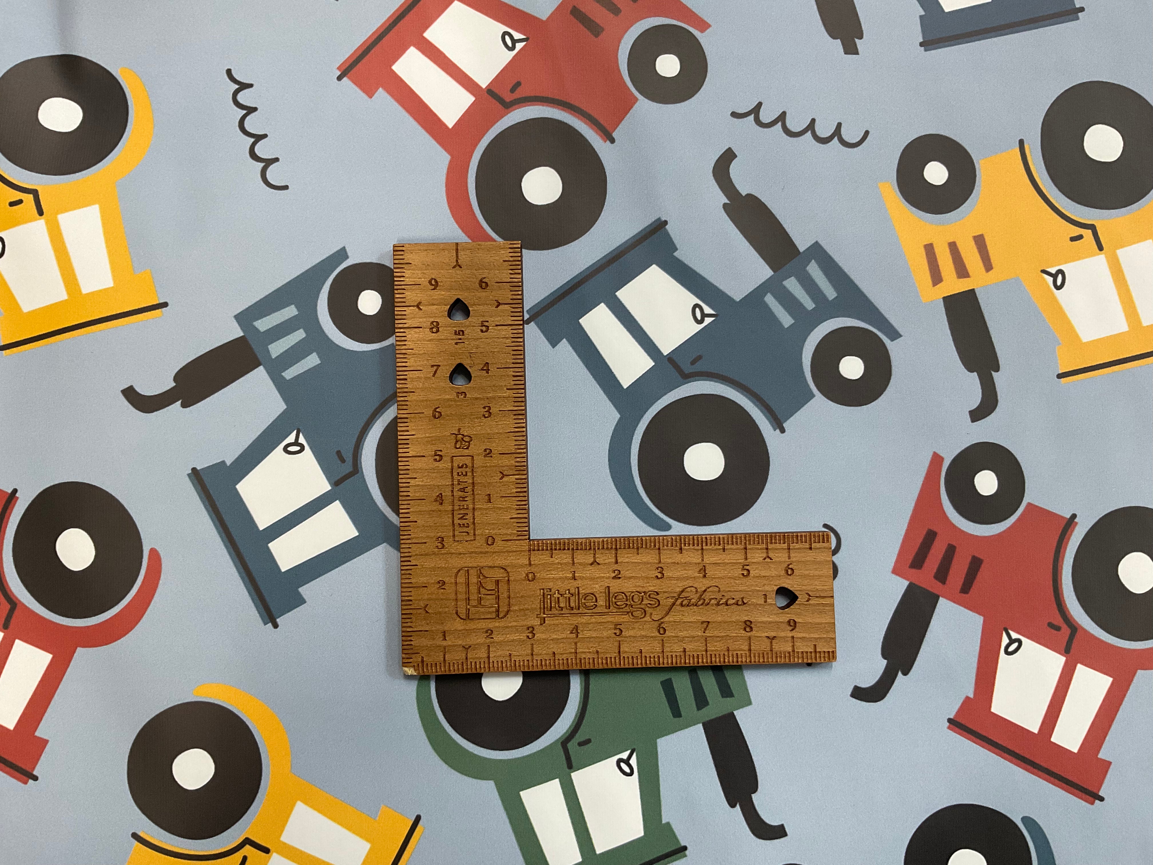 Tractors on Light Blue PU Raincoat Fabric