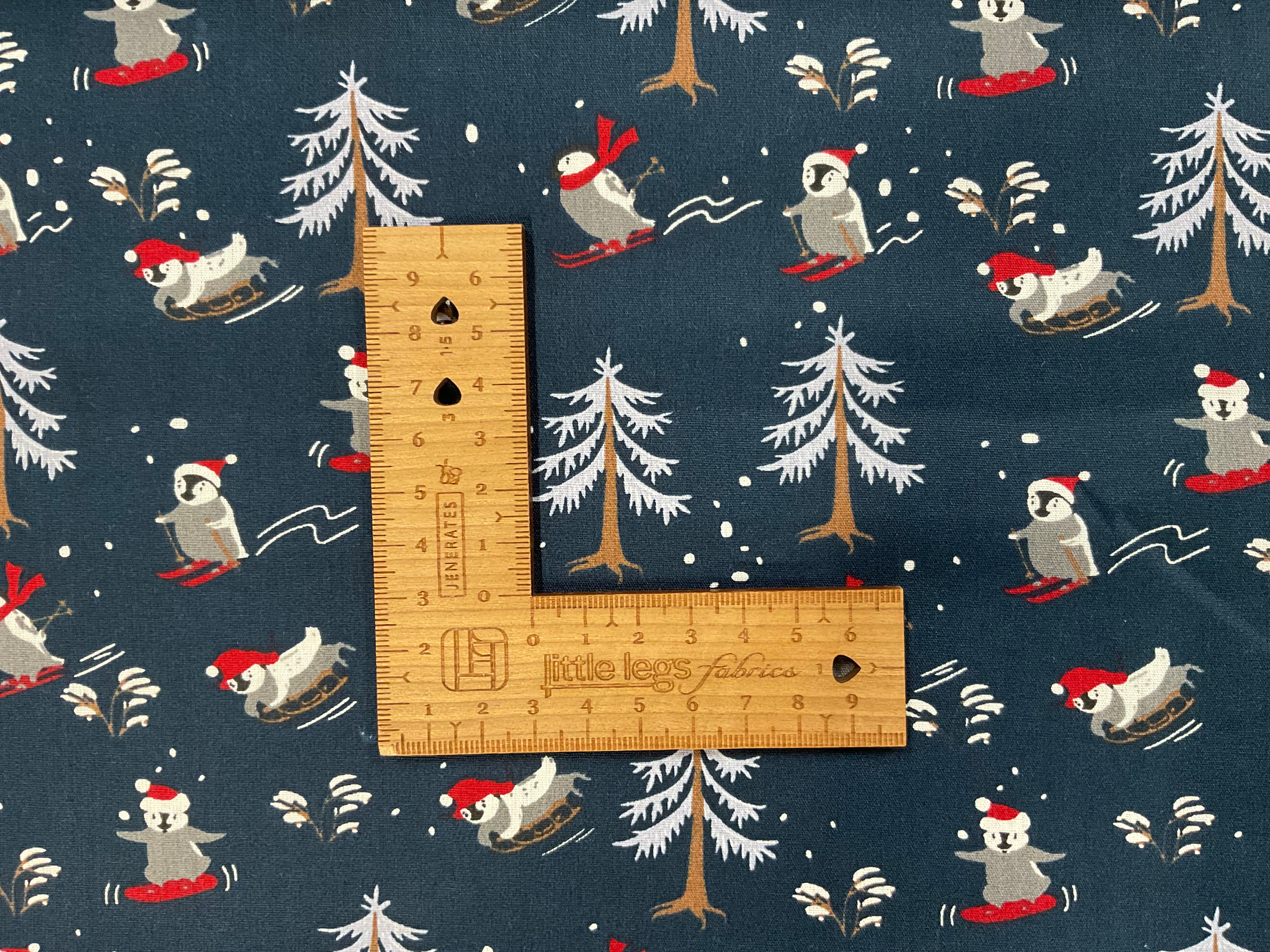 Skiing Penguins on Navy 100% Cotton