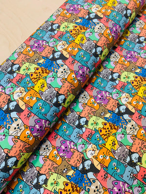 Colourful cats design printed on soft cotton jersey fabric, ideal for vibrant textiles and creative apparel projects